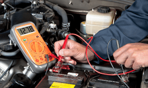 mechanic checking car battery
