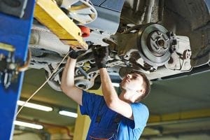 a mechanic repairing a car from oakland park
