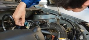 a mechanic repairing a car in hillsboro beach
