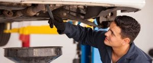 a mechanic checking the car