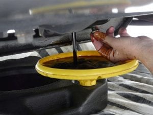 car oil draining into a container